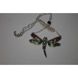 A SILVER PLIQUE-A-JOUR DAMSEL FLY NECKLACE SET WITH PERIDOT GARNETS, RUBIES AND MARCASITES