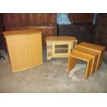 THREE ITEMS, AN OAK NEST OF THREE TABLES, A TV MEDIA UNIT STAND AND A MODERN SKOVBY BOW FRONTED