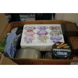 A BOX OF COLLECTABLE TINS TOGETHER WITH A GOLDEN SHRED PAPER BAG CONTAINING CHARACTER LABELS,