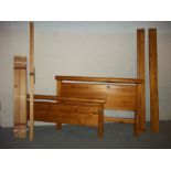 A DOUBLE SOLID PINE BED FRAME WITH FITTINGS