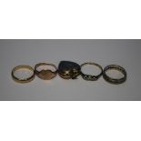 FOUR 9 CT GOLD RINGS TO INCLUDE A SIGNET RING AND A WEDDING BAND, AND A 9 CT GOLD HEART SHAPED