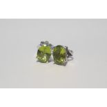 A PAIR OF PERIDOT SILVER STUDS