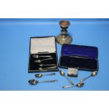 A QUANTITY OF SILVER ITEMS TO INCLUDE A CANDLESTICK, SPOONS, SUGAR TONGS ETC.