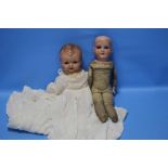 A VINTAGE ARMAND MARSEILLE PORCELAIN HEADED DOLL TOGETHER WITH ANOTHER A/F