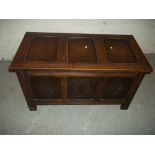 AN OAK PANNELLED BLANKET CHEST COFFER