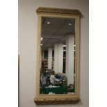 A FRAMED WALL HANGING MIRROR APPROX. 115 X 51 CM
