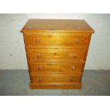 A SOLID PINE FOUR DRAW CHEST