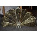 A VINTAGE BRASS PEACOCK FAN FIREGUARD