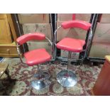 TWO RETRO STYLE RED BAR STOOLS