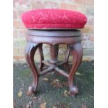 AN EDWARDIAN MAHOGANY CIRCULAR RISE-UP PIANO STOOL