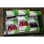 A TRAY OF BOXED CONTROLLERS