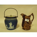 A WEDGWOOD LIDDED JASPERWARE CRACKER BARREL TOGETHER WITH A JUG