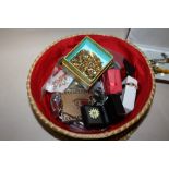 A BASKET OF COSTUME JEWELLERY