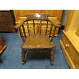AN ANTIQUE TRADITIONAL ELM SMOKERS BOW ARMCHAIR