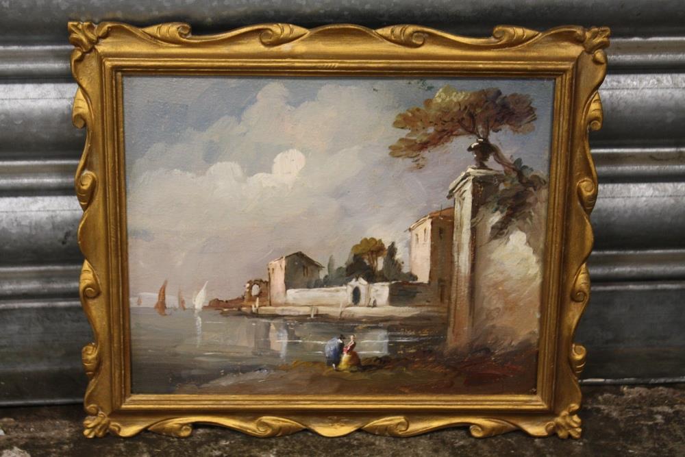 A SMALL GILT FRAMED CONTINENTAL OIL ON BOARD DEPICTING A COASTAL VILLAGE SCENE