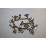 A VINTAGE SILVER CHARM BRACELET- APPROX WEIGHT 47G