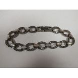 A LADIES VINTAGE 925 SILVER MARCASITE AND MOTHER OF PEARL BRACELET
