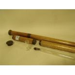 A PAIR OF UNUSUAL LIGHT OAK AND BRASS WALKING CANES WITH INTERIOR SPIRIT FLASKS AND MINIATURE