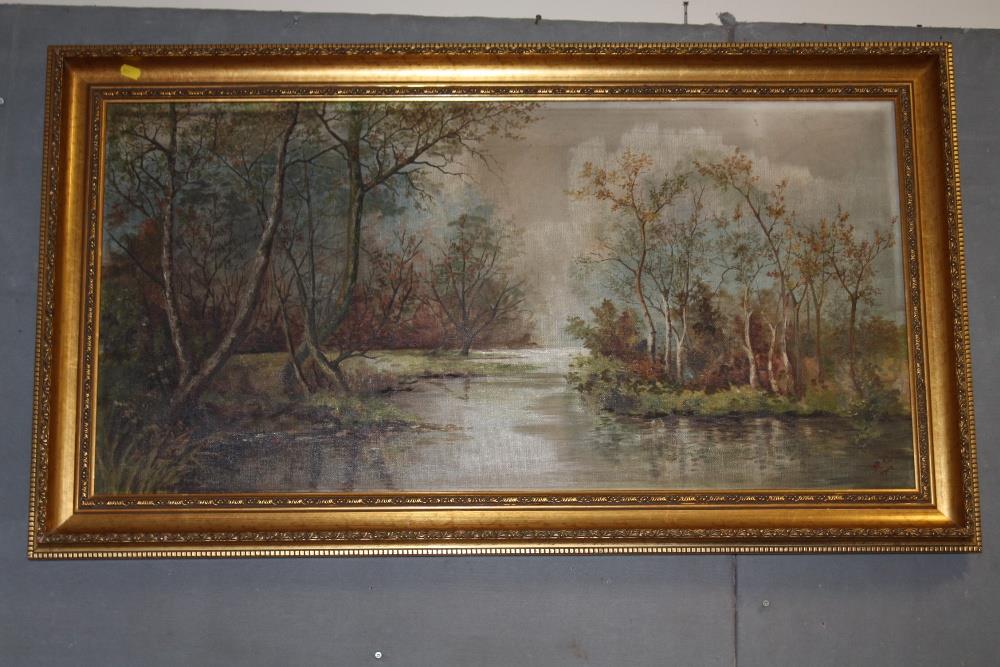 A LARGE GILT FRAMED OIL ON CANVAS DEPICTING A WOODLAND RIVER LANDSCAPE INITIALLED R G LOWER RIGHT