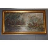 A LARGE GILT FRAMED OIL ON CANVAS DEPICTING A WOODLAND RIVER LANDSCAPE INITIALLED R G LOWER RIGHT