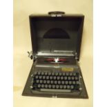 A CASED VINTAGE IMPERIAL TYPEWRITER