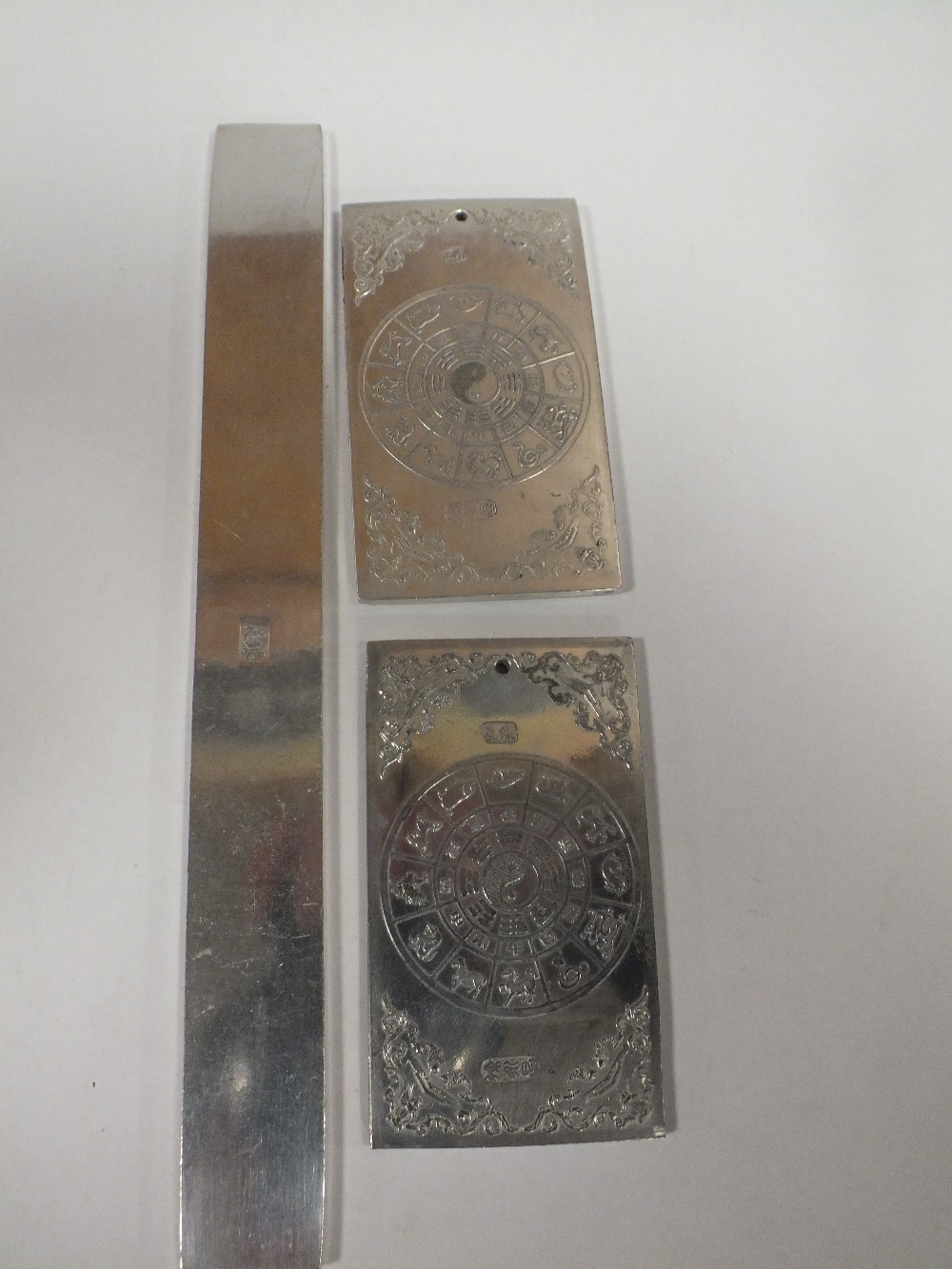 THREE ORIENTAL WHITE METAL SCROLL WEIGHTS - Image 2 of 2