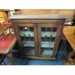 A VINTAGE OAK GLAZED/LEADED BOOKCASE H-96 CM W-82 CM