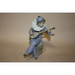 A NAO FIGURE OF A BOY PLAYING LUTE