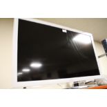 A PANASONIC 31" FLATSCREEN TV WITH REMOTE AND INSTRUCTIONS