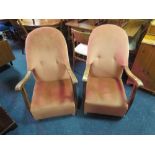 A PAIR OF VINTAGE OAK FRAMED UPHOLSTERED ARMCHAIRS