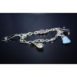 A MODERN STERLING SILVER CHARM BRACELET, TOTAL WEIGHT 10.3 G