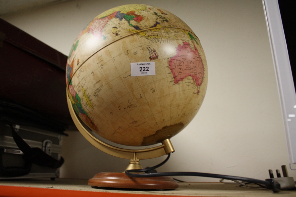 AN ILLUMINATING GLOBE ON STAND