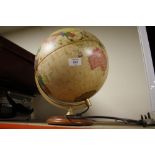 AN ILLUMINATING GLOBE ON STAND