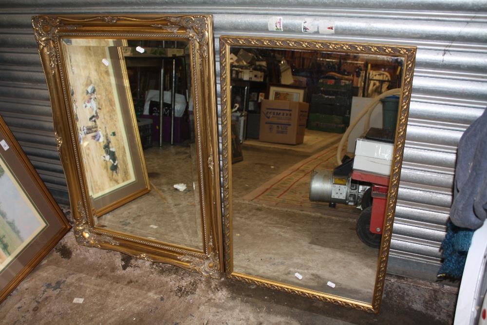 A LARGE GILT FRAMED BEVEL EDGED WALL MIRROR OVERALL - 91CM X 66CM, TOGETHER WITH A SMALLER