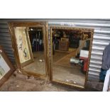 A LARGE GILT FRAMED BEVEL EDGED WALL MIRROR OVERALL - 91CM X 66CM, TOGETHER WITH A SMALLER