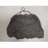 A VINTAGE LADIES WHITE METAL MESH PURSE