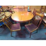 A RETRO TEAK EXTENDING DINING TABLE AND 4 CHAIRS TABLE H-73 CM W-117 CM EXTENDED W-171 CM