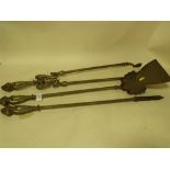 A SET OF ANTIQUE BRASS FIRE IRONS