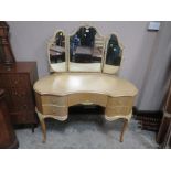 A VINTAGE KIDNEY SHAPED DRESSING TABLE WITH TRIPLE MIRROR W 125CM