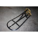 A BRASS AND CAST METAL HORSE SADDLE RACK TOGETHER WITH A BRASS STICK STAND