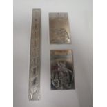 THREE ORIENTAL WHITE METAL SCROLL WEIGHTS