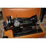 A CASED VINTAGE SEWMAC DELUX SEWING MACHINE