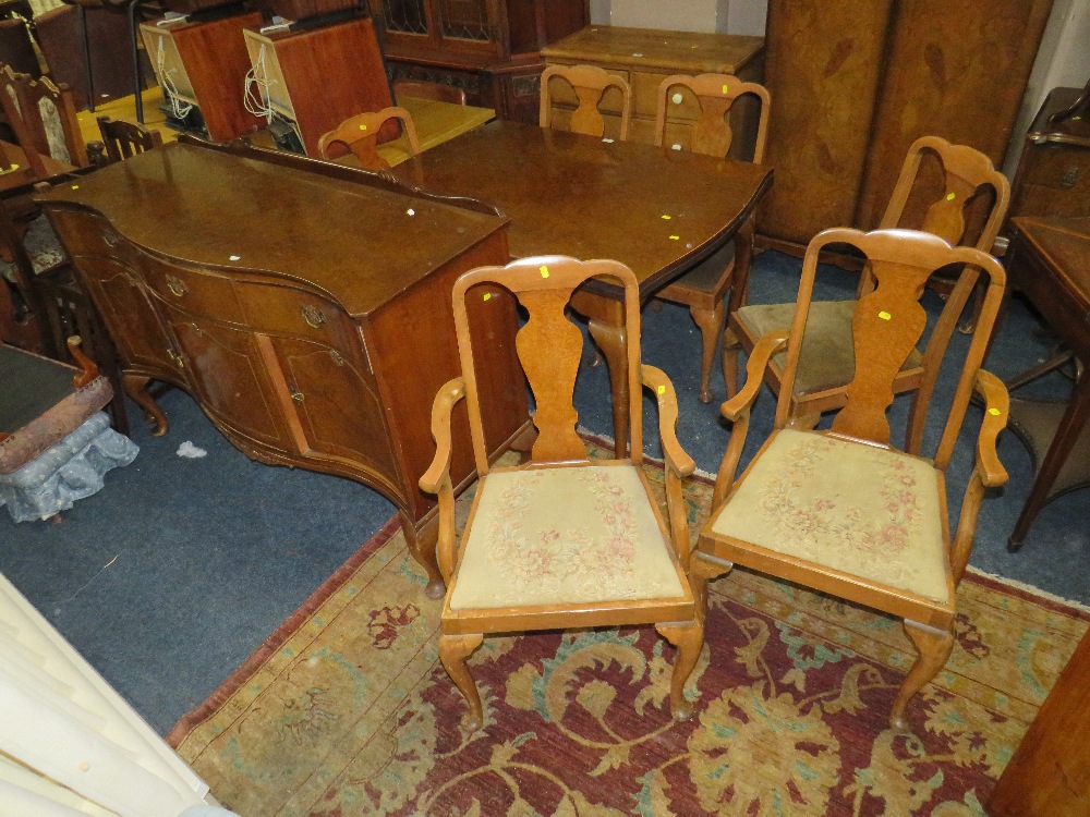 A RETRO WALNUT DRAWLEAF DINING TABLE, SIX CHAIRS AND A SIDEBOARD