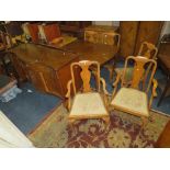 A RETRO WALNUT DRAWLEAF DINING TABLE, SIX CHAIRS AND A SIDEBOARD