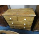 AN ANTIQUE SMALL PINE FOUR DRAWER CHEST ON BUN FEET H-86 CM W-89 CM