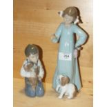 TWO NAO FIGURES OF CHILDREN WITH DOGS, NO MODEL NUMBER