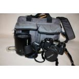 A NIKON FE2 CAMERA TOGETHER WITH TAMRON LENSES, ETC. IN CARRY CASE