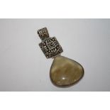 A LARGE STERLING SILVER POLISHED STONE PENDANT