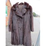 A VINTAGE RICH MAHOGANY BROWN MINK FUR COAT, fully lined, hook fasteners, front pockets, approx size