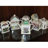 A COLLECTION OF WADE NOVELTY TEAPOTS